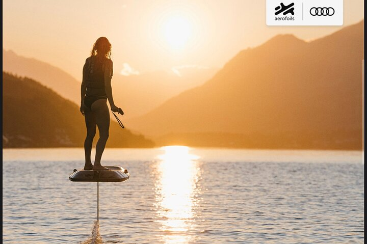 Experience the unique sensation of gliding above the water with the Audi Foil surrounded by stunning landscapes and serene waters perfect for all skill levels.